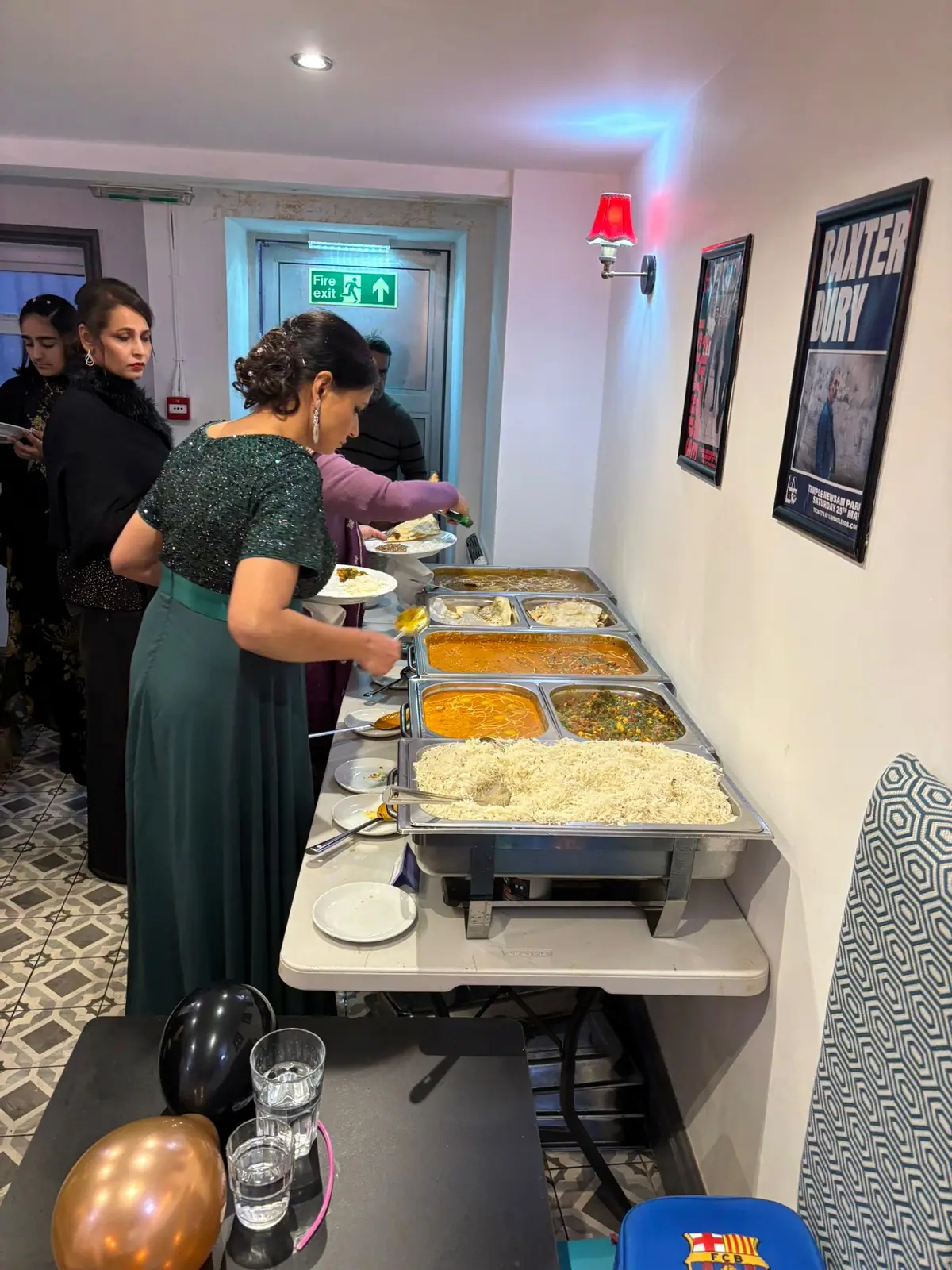 Bombay2Goa team serving a hot buffet line at a catered event
